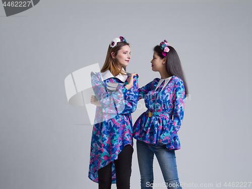 Image of two Fashion Model girls isolated over white background