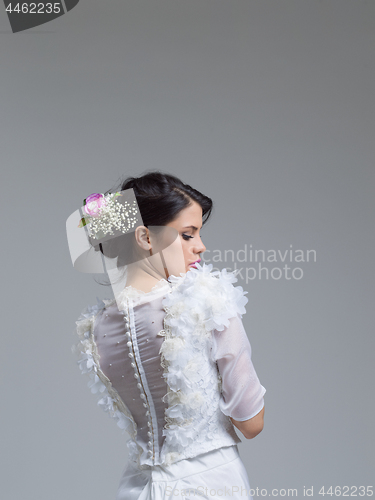 Image of Rear view of a beautiful young woman in a wedding dress