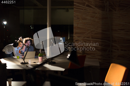Image of young designers in the night office