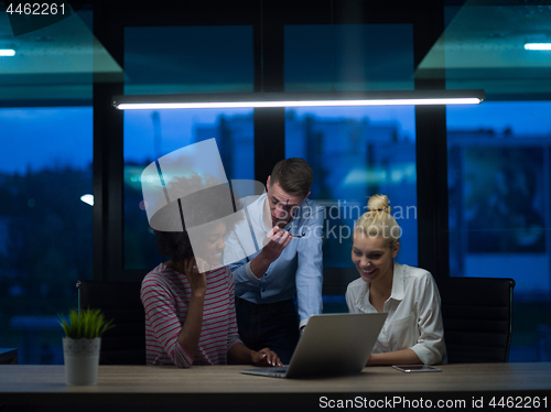 Image of Multiethnic startup business team in night office