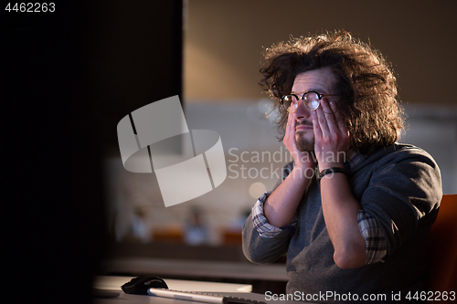 Image of businessman relaxing at the desk