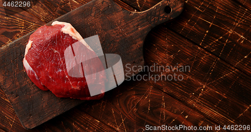 Image of Raw meat on chopping board