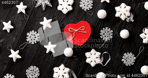 Image of Christmas decorations and gift in heart shape