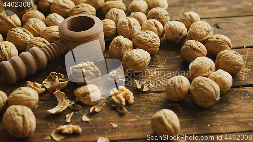 Image of Walnuts and nutcracker on table