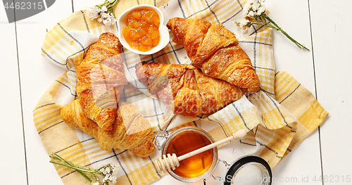 Image of Croissants and condiments composition