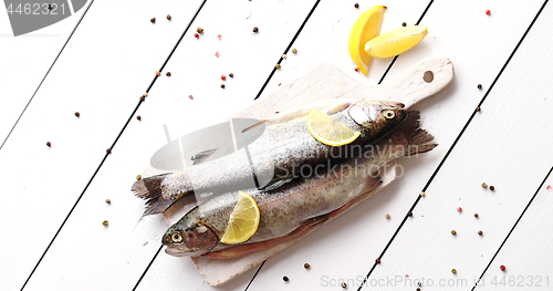 Image of Lemon and pepper around fish