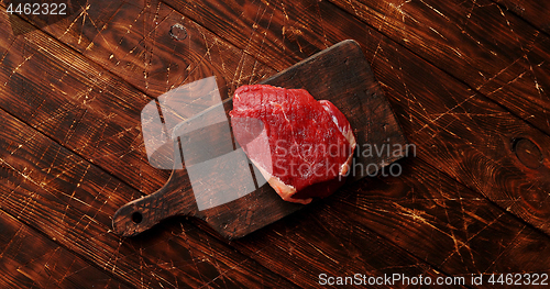 Image of Raw meat on chopping board