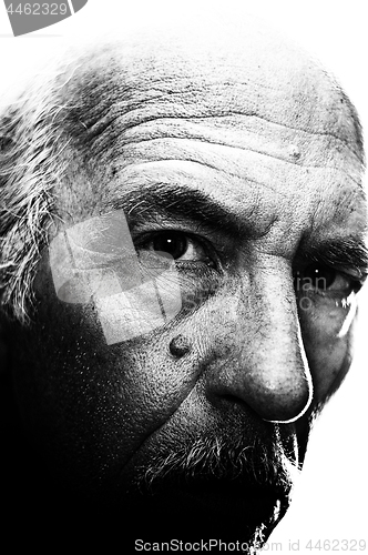 Image of high contrast highly detailed face of man looking at viewer