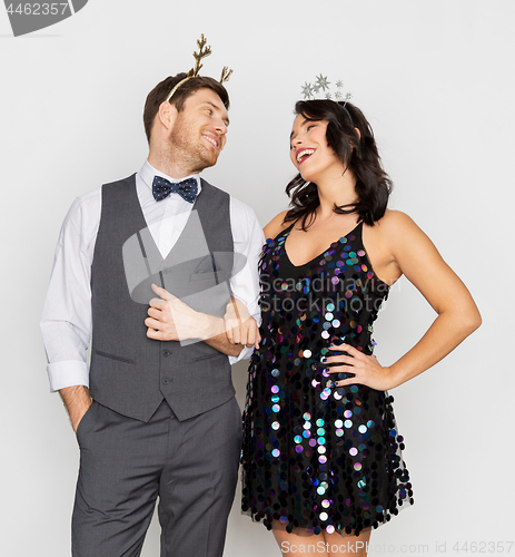 Image of couple with christmas or new year party props