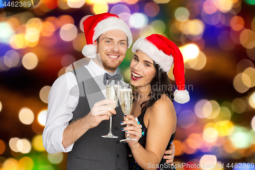 Image of couple with champagne glasses at christmas party