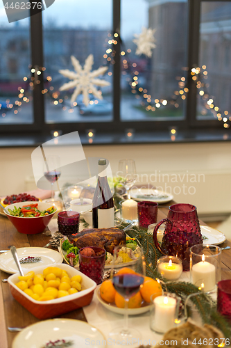 Image of food and drinks on christmas table at home