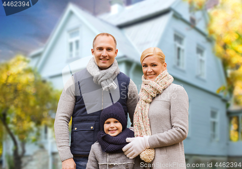 Image of happy family over living house in autumn