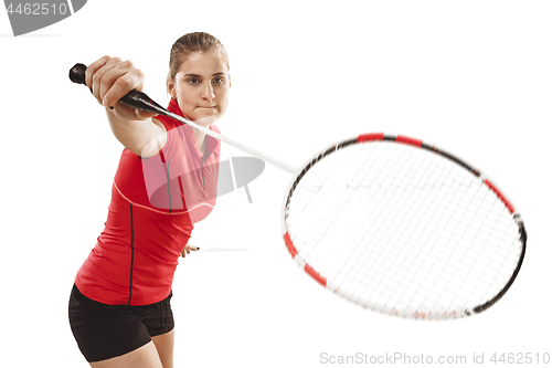 Image of Young woman playing badminton over white background