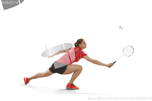 Image of Young woman playing badminton over white background