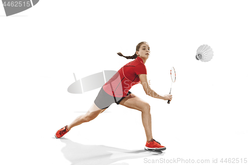 Image of Young woman playing badminton over white background