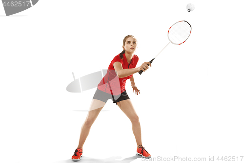 Image of Young woman playing badminton over white background