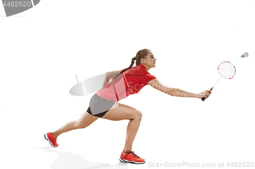 Image of Young woman playing badminton over white background