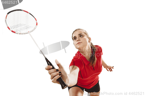 Image of Young woman playing badminton over white background