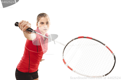 Image of Young woman playing badminton over white background