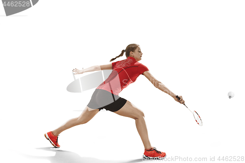 Image of Young woman playing badminton over white background