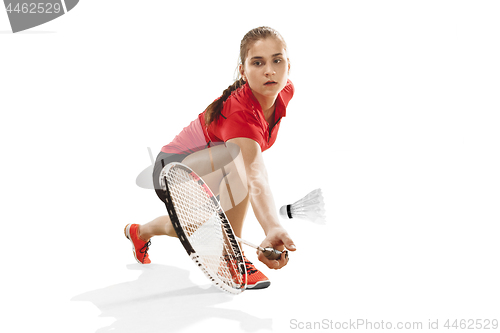 Image of Young woman playing badminton over white background