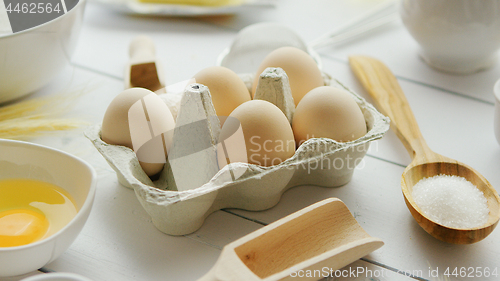 Image of Cooking ingredients and tools around eggs