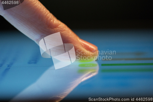 Image of close up of hand using computer touch screen