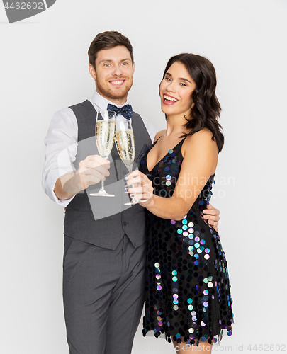 Image of happy couple with champagne glasses at party