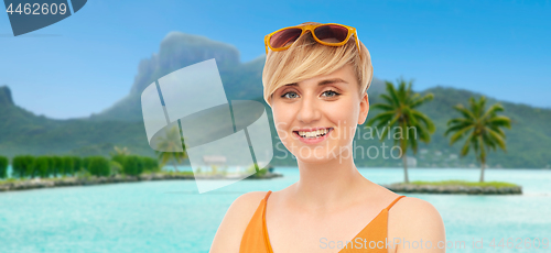 Image of portrait of smiling teenage girl with sunglasses