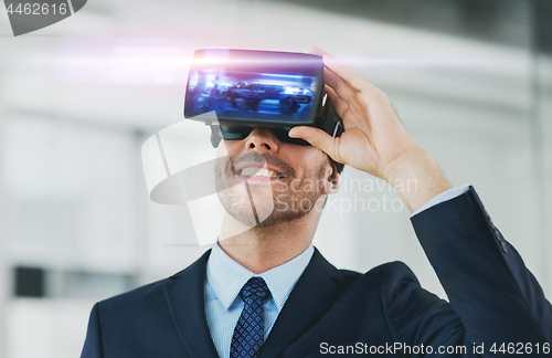 Image of businessman with virtual reality headset at office