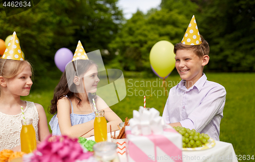 Image of happy kids on birthday party at summer garden