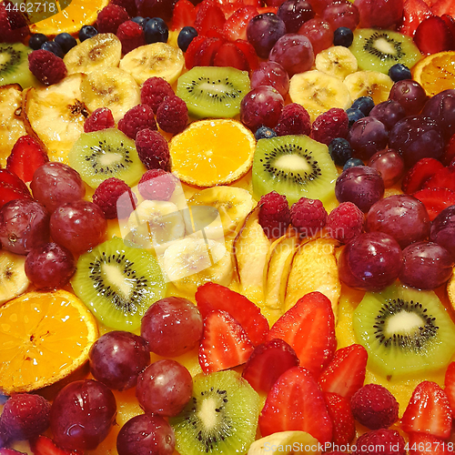Image of Holiday cake with fruits and berries, close-up food background