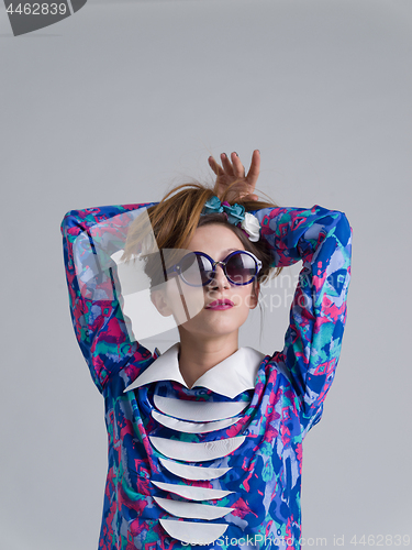 Image of woman posing in fashionable clothes and sunglasses