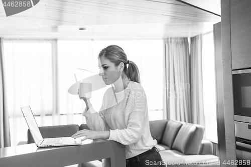 Image of woman drinking coffee enjoying relaxing lifestyle