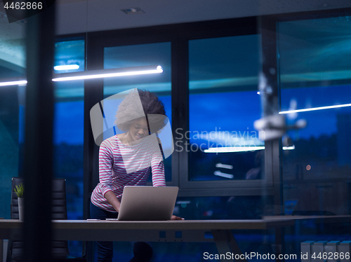 Image of black businesswoman using a laptop in startup office