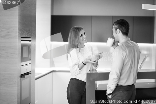 Image of A young couple is preparing for a job and using a laptop