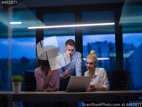 Image of Multiethnic startup business team in night office