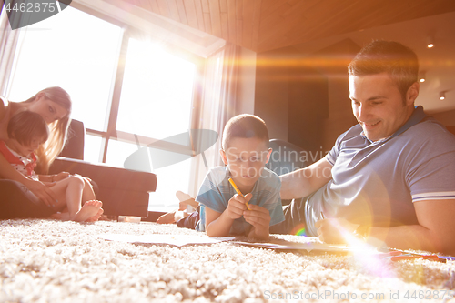 Image of young couple spending time with kids