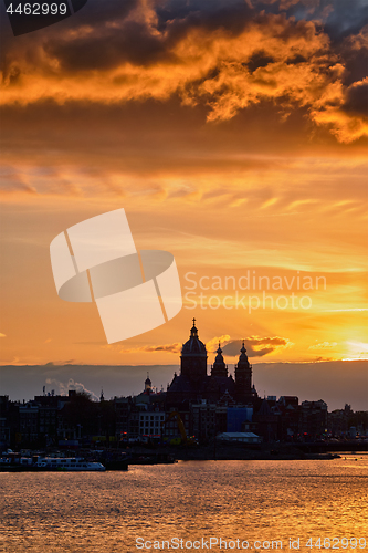 Image of Amsterdam cityscape skyline with  Church of Saint Nicholas on su