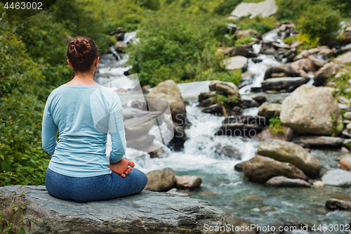 Image of Woman in Padmasana outdoors