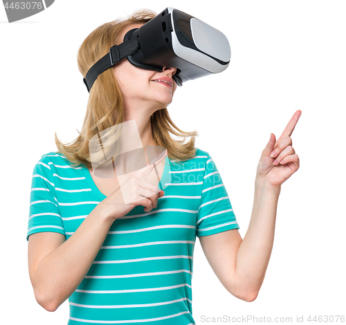 Image of Woman looking in VR glasses