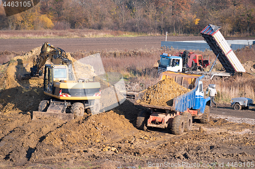 Image of Excavator digging soil