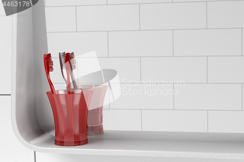 Image of Two red toothbrushes