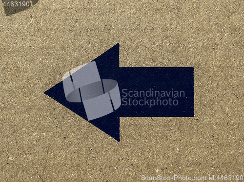 Image of Vintage looking Black arrow on cardboard