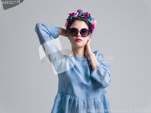 Image of woman posing in fashionable clothes and sunglasses