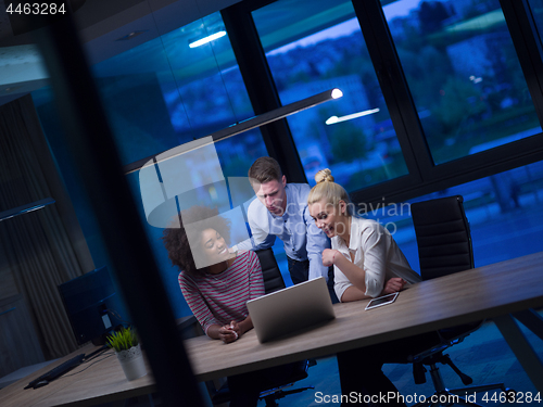 Image of Multiethnic startup business team in night office