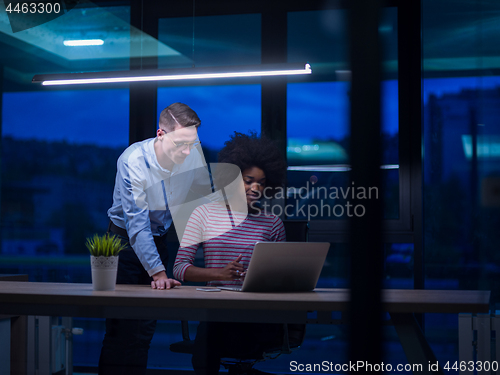 Image of Multiethnic startup business team in night office