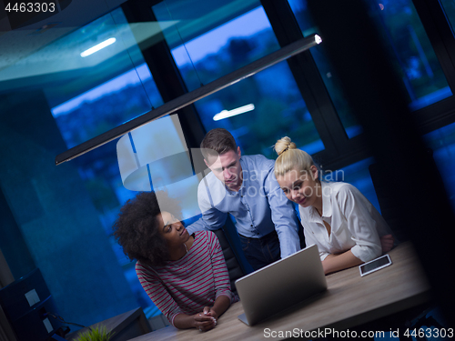 Image of Multiethnic startup business team in night office