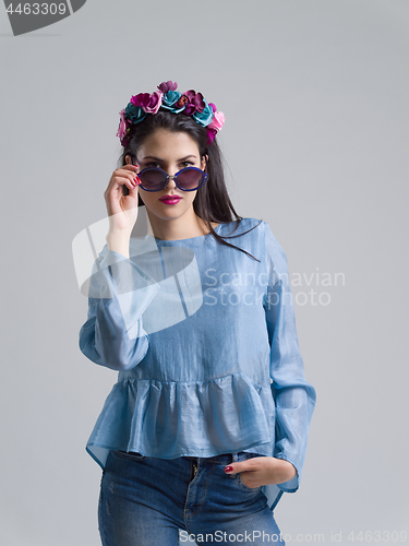 Image of woman posing in fashionable clothes and sunglasses