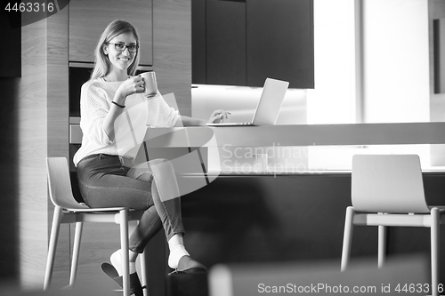 Image of woman drinking coffee enjoying relaxing lifestyle